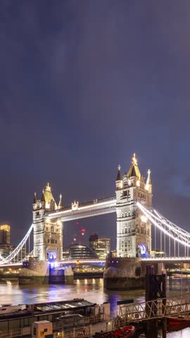 Time Lapse of the Tower Bridge over the River Thames in London at Night. Vertical Video.