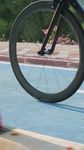 Bike wheel rotation, close up. Bike gear, close up. Vertical video