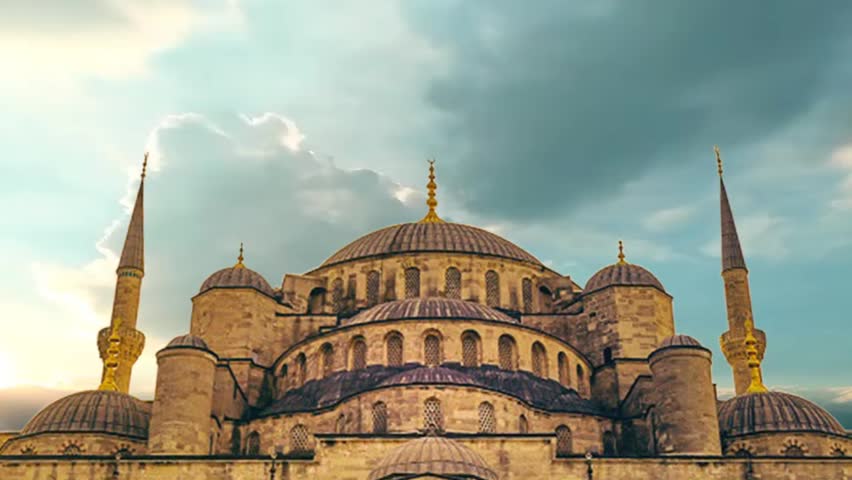 The Blue Mosque in Istanbul, Turkey, with a cloudy sky and archways