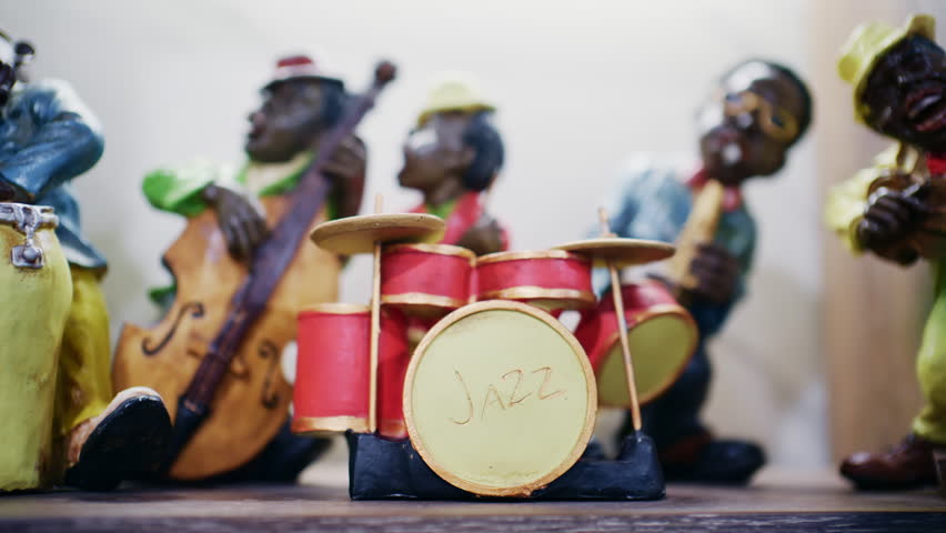 Decorative jazz band figurines playing instruments including drums and double bass