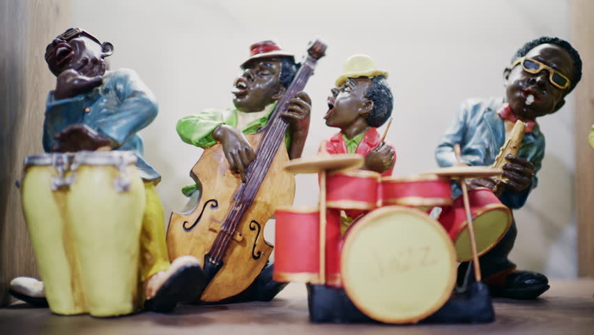 Decorative jazz band figurines playing instruments including drums and double bass