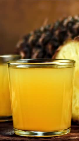 Piece of pineapple falls into pineapple juice. Filmed is slow motion 1000 fps. High quality FullHD footage