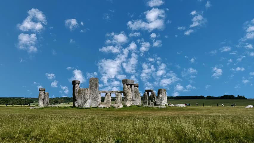 Stonehenge in Wiltshire of England in cloudy weather. It is a prehistoric monument 8 miles north from Salisbury, in the place called Wiltshire in South West England. It is under protection of UNESCO. Drone view of Stonehenge and Wiltshire Countryside in England, UK. The stone circle dates to 3000 BC and is one of the best known ancient wonders of the world and UNESCO World Heritage Site.