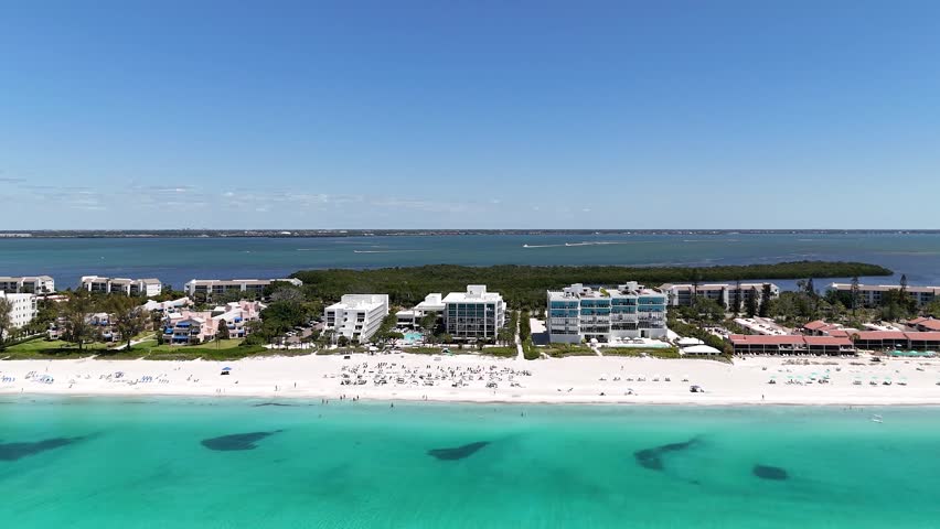 Drone Shot of Longboat Key, Florida USA, White Sand Beach, Turquoise Sea and Beachfront Buildings