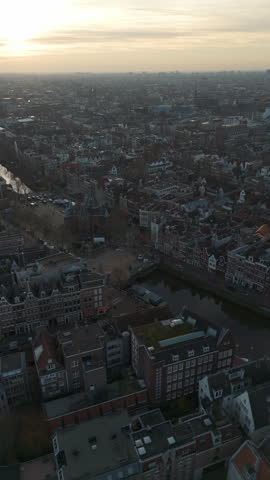 Vertical aerial of De Waag building and canals in downtown Amsterdam, Holland
