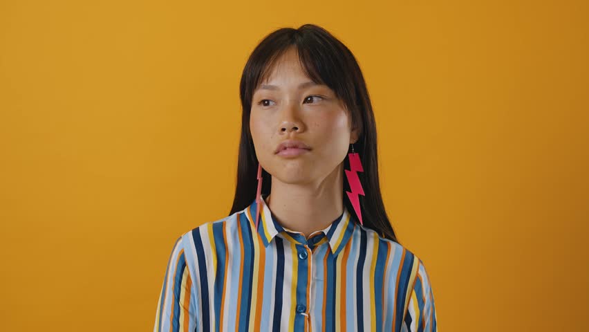 Beautiful asian woman portrait, young asian woman posing looking at camera.
