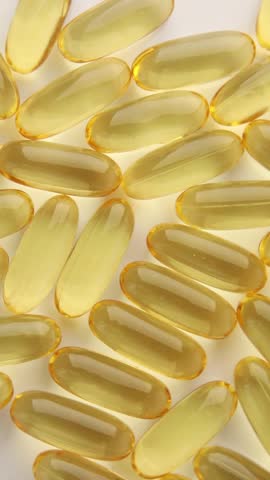Rotation Closeup fish oil capsules Omega 3 isolated on white background, Health care concept, macro.
