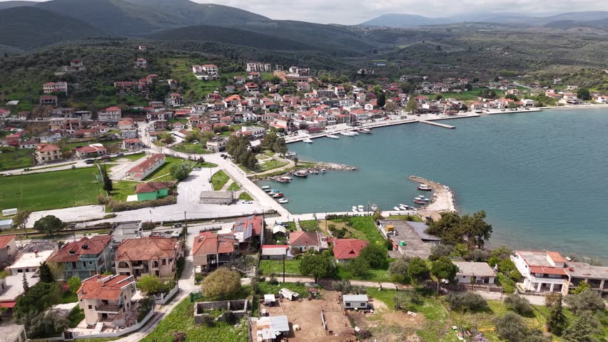Aerial panorama of Achilleio coastal village and harbor in Greece
