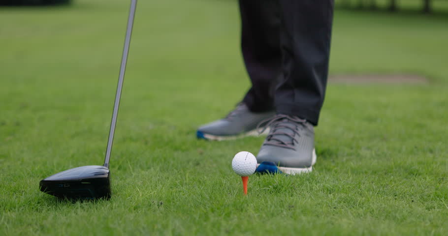 Golf ball, start or hands of man on grass for contest, competition challenge or sports training. Closeup, tee or golfer holding pin for action, games or outdoor gear for fitness, hobby or wellness