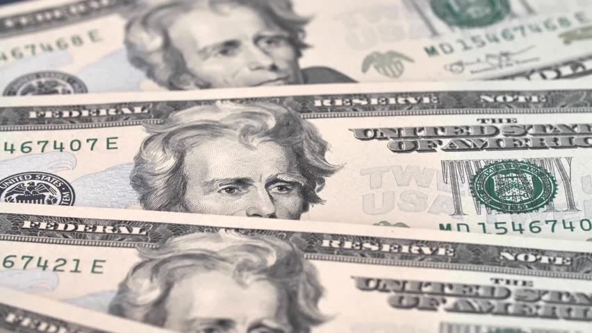 A pile of american dollar paper money at table. Cash dollar money banknotes. Finance and investment concept. Pile of american dollar bills. The concept of earnings and business profitability.