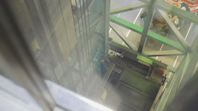 climbing up the elevator, video filmed through glass