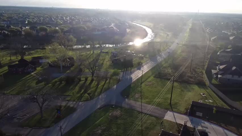Golden sunrise sky over Richmond Texas landscape