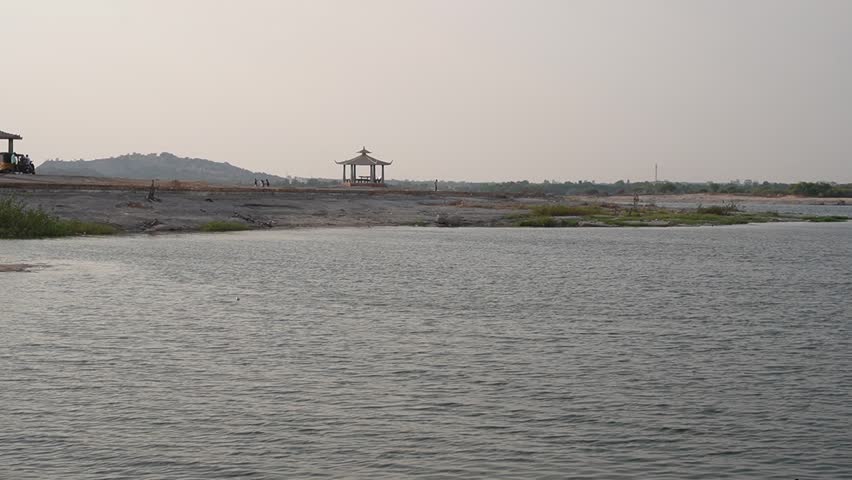 Expansive lake scene with open water, distant shoreline and soft daylight conditions.