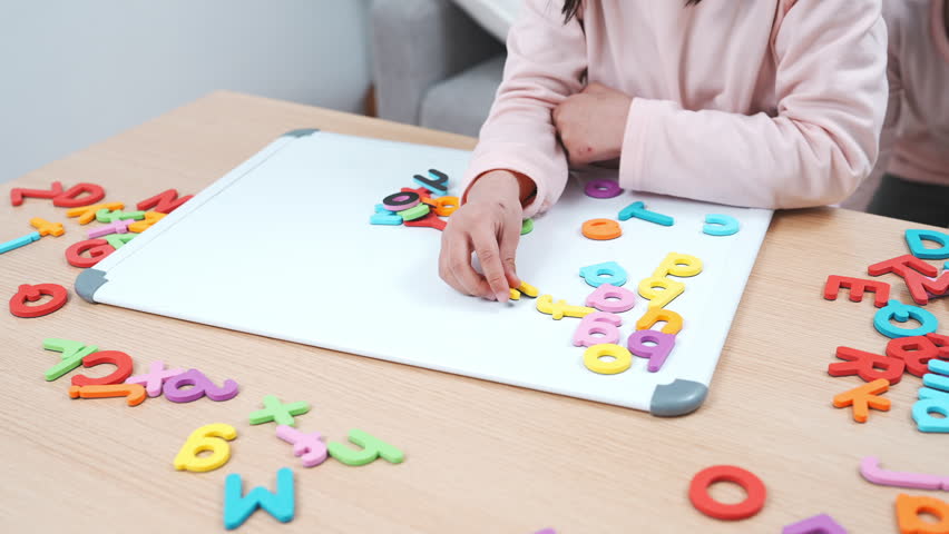 Elementary School Girl Learning the Alphabet