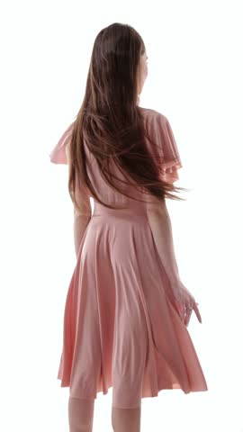 Pink dress 360 rotation video of woman posing in soft studio fashion look. Concept of wedding guest style, boutique campaign, romantic event promo, seasonal collection, and social content.