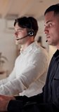 Talking, people and man with headset in call center, troubleshooting advice and customer care at night. Tech support, late hotline or agent with explanation for solution, contact or online help desk - Powered by Shutterstock - Get 15% off with code: PIKWIZARD15