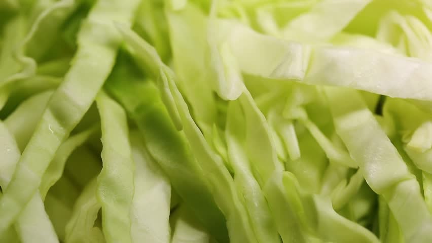 Close-up view of cabbage salad, fresh cabbage chopped in the kitchen, healthy food and vegetables