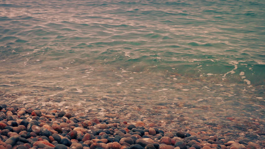 Moving Along Shore As Waves Come In At Sunset