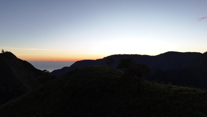 Serene Mountain Landscape at Dawn with Ocean Horizon