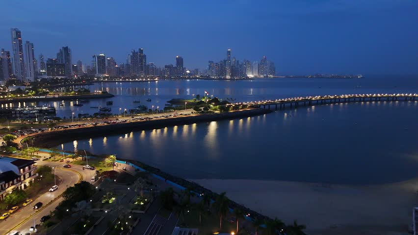 Panama flag waving in front of the Panama City skyline — April 2026