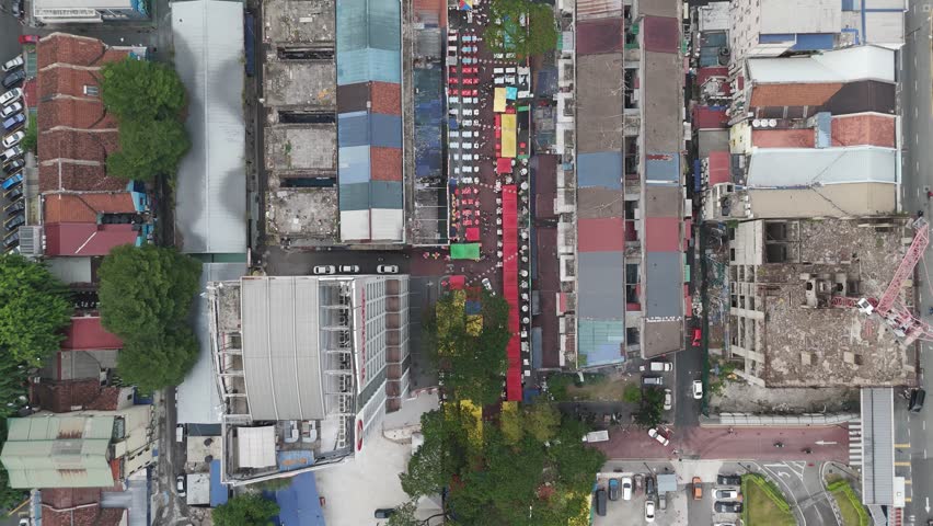A street market nestled between buildings in an urban setting.
