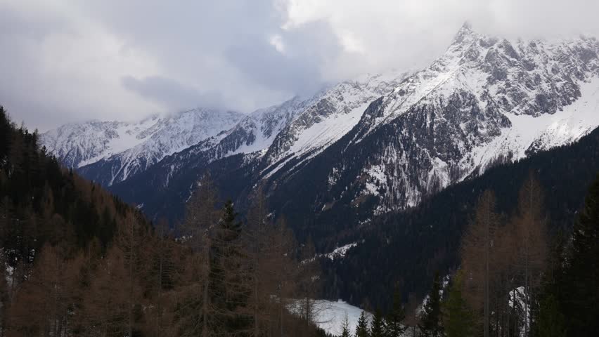 A Timelapse of a valley in South Tirol. The valley lies close to Antholz, a famous Biathlon competition side. Clouds are pressing over the hills and through the valley, throwing nice shadows on trees