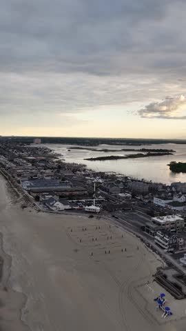 An aerial view of Sea Bright, New Jersey panning from the downtown area of Ocean Avenue toward Rumson across the Shrewsbury River Bridge and ending looking at a distant Manhattan skyline.