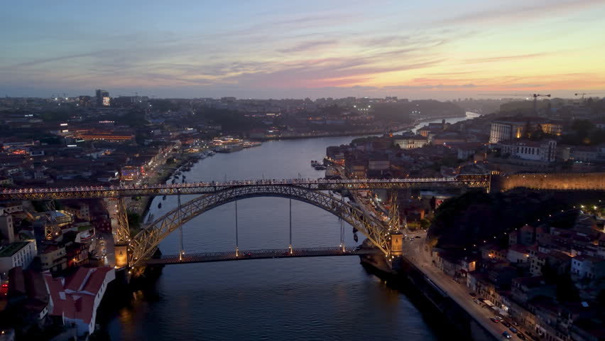 Aerial View of illuminated Porto city. Dom Luis bridge, Portugal