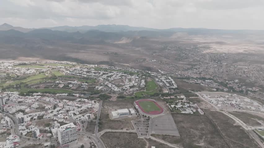Aerial panoramic view of a modern university campus and luxury residential area in San Luis Potosi, Mexico