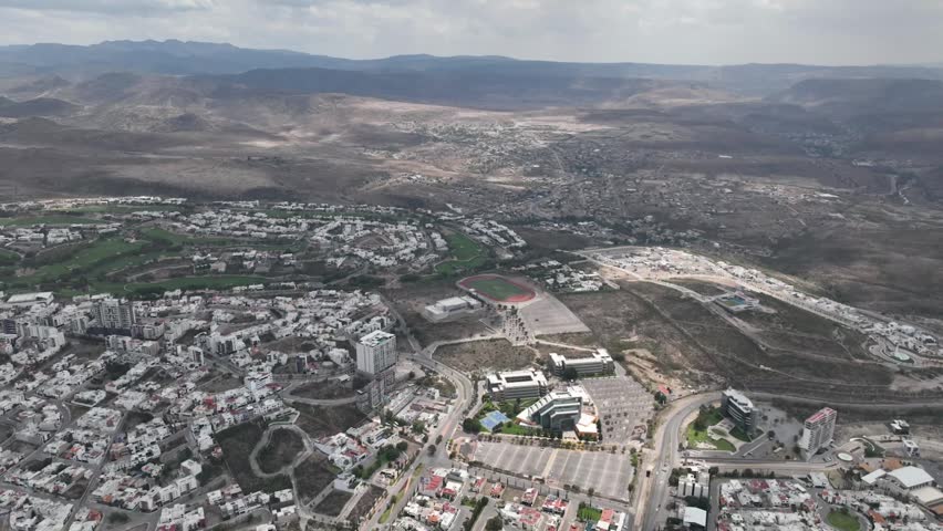 Aerial panoramic view of a modern university campus and luxury residential area in San Luis Potosi, Mexico