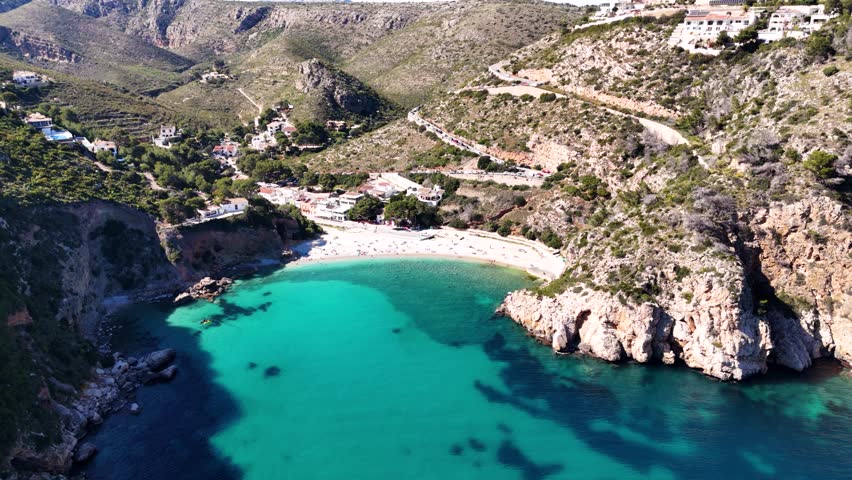 Scenic rocky coast and turquoise sea water along Spain’s beautiful shoreline.
