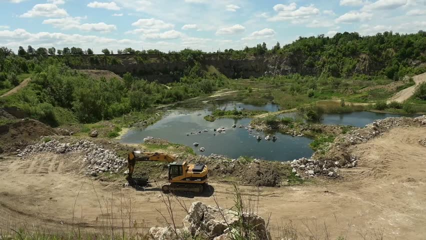 Landscape of an industrial stone quarry on a sunny summer day