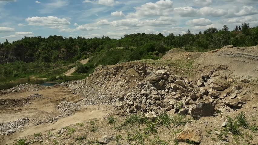 Landscape of an industrial stone quarry on a sunny summer day