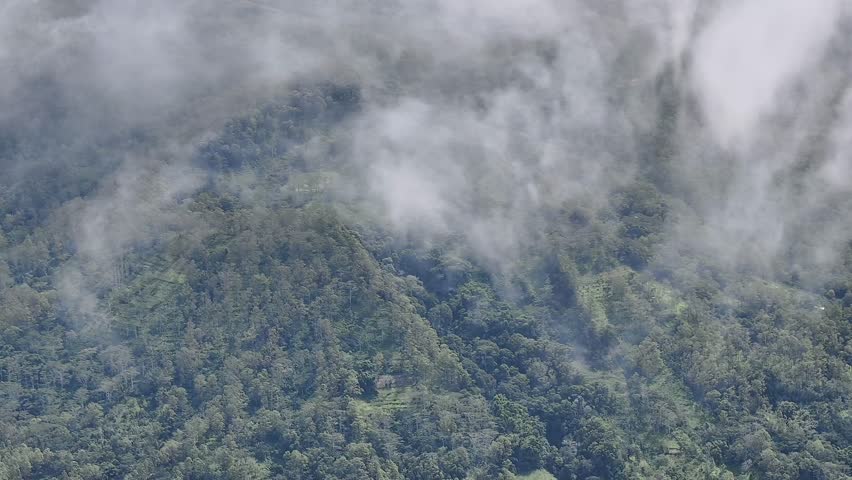 Storm clouds over a mountain peak