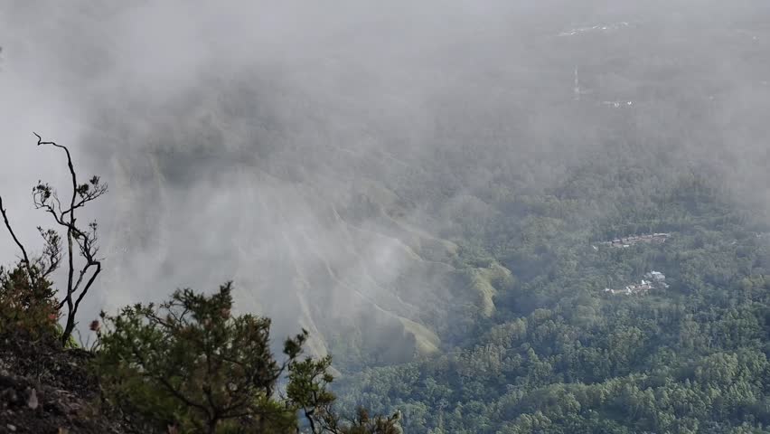 Storm clouds over a mountain peak