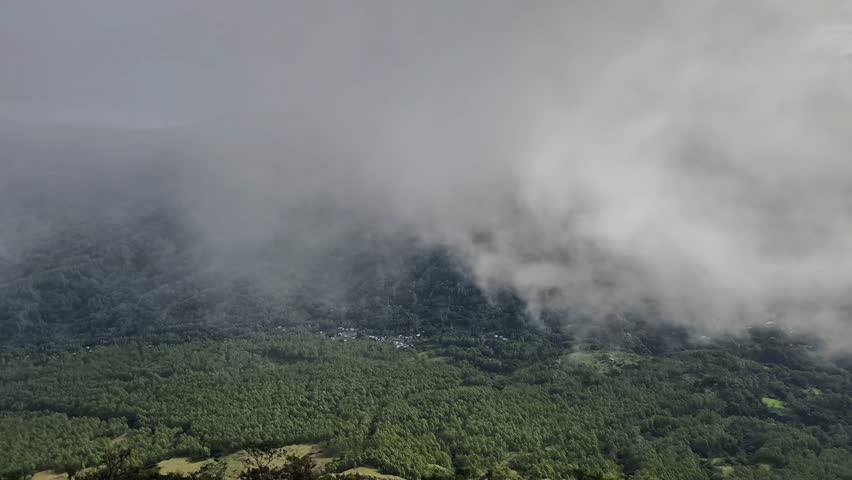 Storm clouds over a mountain peak