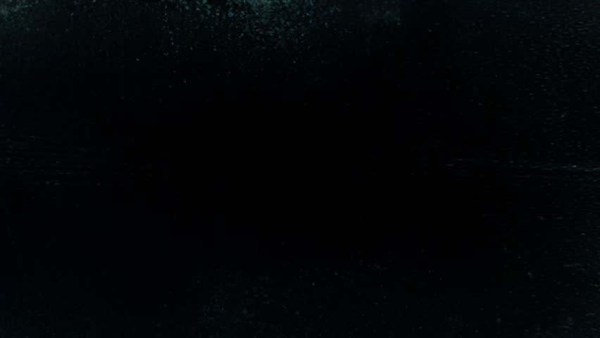 Animated abstract deep black and dark teal grunge texture background with muted green-blue undertones, rough worn surface, faint scratches, dirty analog grain, distressed paper-wall feel and shadowy matte atmosphere, forming a minimal industrial overlay with aged weathered depth and subdued contemporary texture character