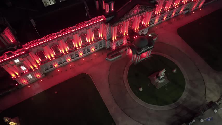 Rising aerial GV of Belfast City Hall in Belfast City Centre at night. Produced in 3840x2160 4K and with Rec709 color.