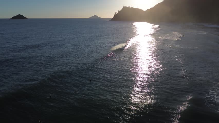 Sunset over the ocean surf