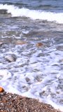 Beach Surf Ambiance. Gentle Waves Over Rocky Shore. Rolling Foam Crashing Onto Pebbled Coastline. Energetic Shoreline Waves With Bubbling Foam And Rocky Details - Powered by Shutterstock - Get 15% off with code: PIKWIZARD15