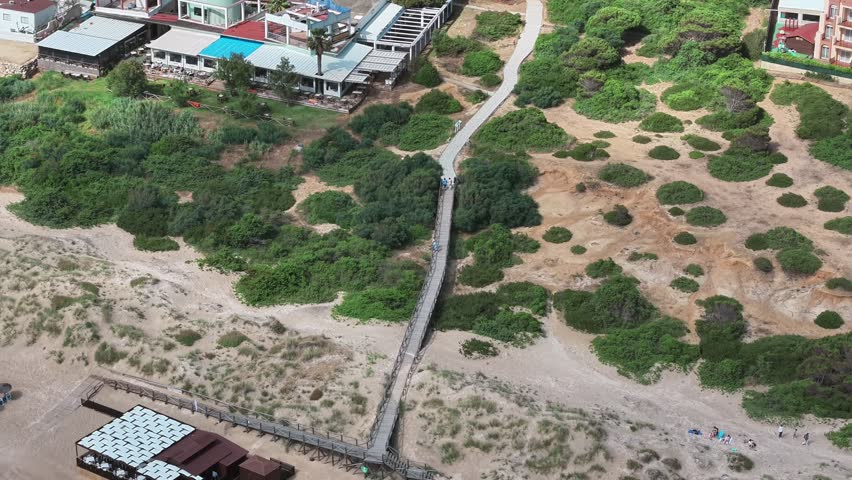 From houses to sand beach and rolling wave