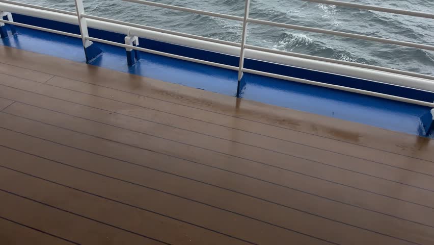 Tilt Up From Cruise Ship Deck to Reveal Antarctica Moody Weather Glaciers, Mountains, Exciting Travel. Low Clouds Dark Rock Ice and Snow