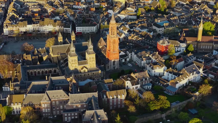 Aerial panoramic view above the city Maastricht beside the old town on a sunny afternoon in the Netherlands.