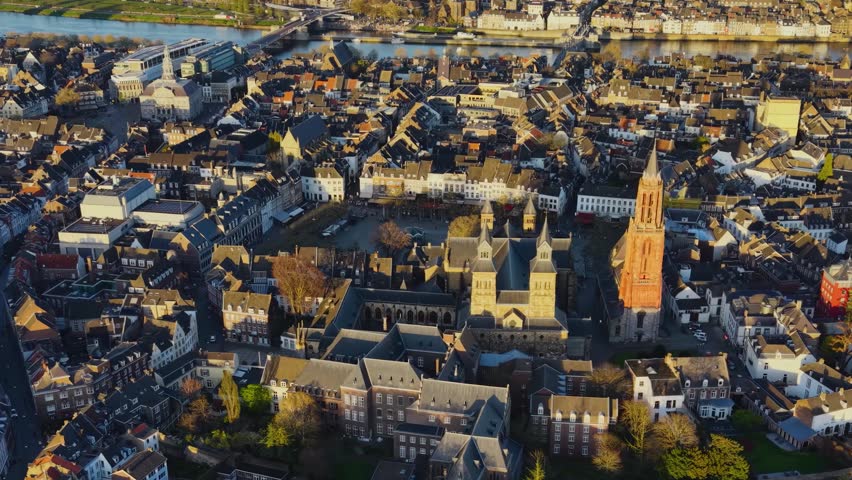 Aerial panoramic view above the city Maastricht beside the old town on a sunny afternoon in the Netherlands.
