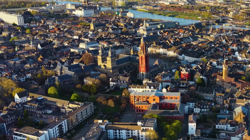 Aerial panoramic view above the city Maastricht beside the old town on a sunny afternoon in the Netherlands.