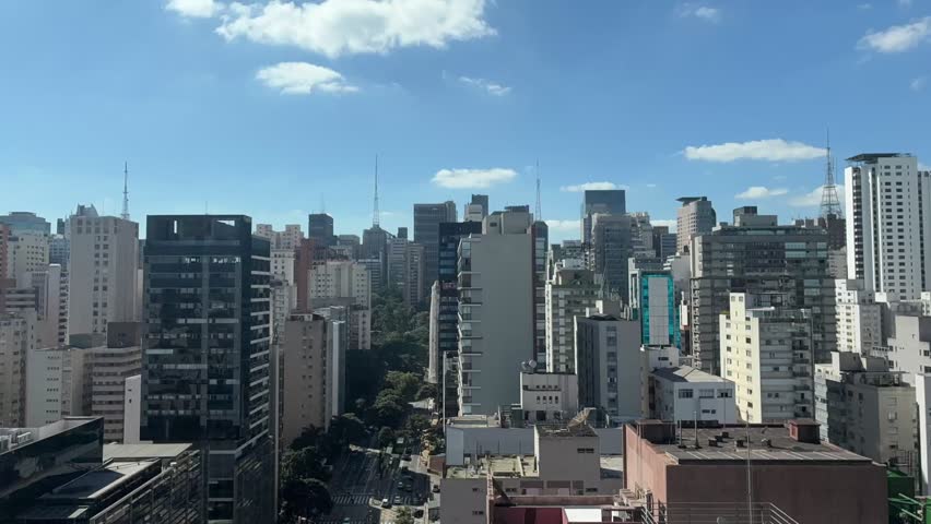 Daytime Timelapse of Sao Paulo Skyline with Blue Sky and Moving Clouds Over a Modern Metropolis