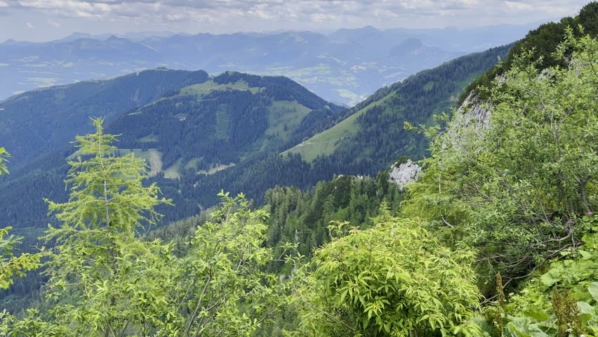 Static high angle landscape shot shows the Austrian Alps countryside in the summer near Berchtesgaden. 