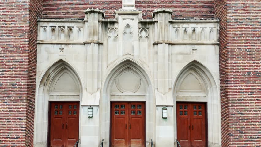 The front facade of a cathedral that practices the catholic religion.