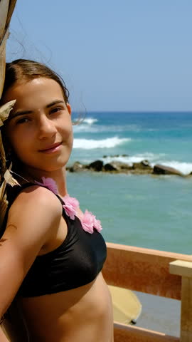 Woman looking at the sea. Selective focus. summer.