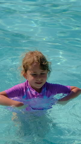 Child swimming in the pool. Selective focus. kid.